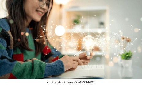 The concept of continuous learning and development. Women read books to enhance their thinking and imagination intelligence. Holding a bright light bulb there are connected polygons on the background.