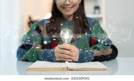 The concept of continuous learning and development. Women read books to enhance their thinking and imagination intelligence. Holding a bright light bulb there are connected polygons on the background.