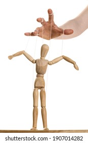 Concept Of Control. Marionette In Human Hand.