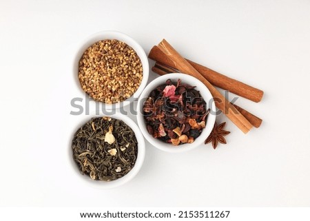 Concept of cooking tea with different types of tea on white background