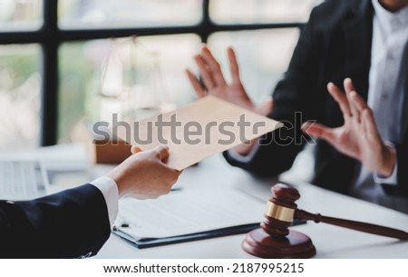 Concept of corruption, bankruptcy court, bail, crime, bribery, fraud, Judge Gavel, soundboard and a handful of cash on the table. Foto stock © 