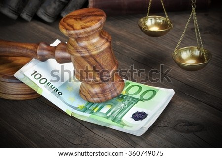 Concept For Corruption, Bankruptcy Court, Bail, Crime, Bribing, Fraud.  Judges or Auctioneer Gavel And Bundle Of Euro Cash On The Rough Wooden Table. Top View