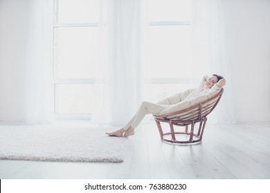 Concept Of Coziness, Serenity And Relaxation. Life Is Good! Pretty Beautiful Calm Joyful Woman In Casual Outfit Is Sitting On The Modern Armchair In Her Roomy Flat And Having A Daytime Nap