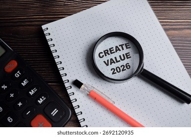 Concept of create value 2026 write on book with keywords isolated on Wooden Table.