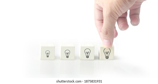 Concept creative idea and innovation. cube block in hand with symbol - Shutterstock ID 1875831931