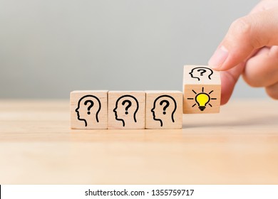 Concept creative idea and innovation. Hand flip over wooden cube block with head human symbol and light bulb icon - Shutterstock ID 1355759717