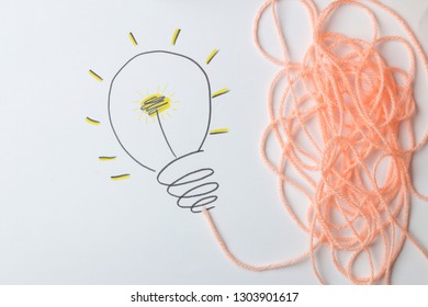 Concept creative idea. concept of creative idea. painted light bulb on a light background. metaphor, inspiration.