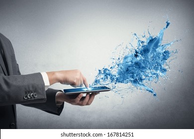 Concept of creative technology with businessman and tablet