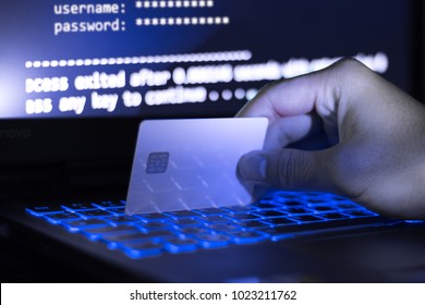 The Concept Of Credit Card Theft. Hackers With Credit Cards On Laptops Use These Data For Unauthorized Shopping. Unauthorized Payments From Credit Card Owners. In The Hacker's Secret Office