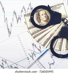 Concept Of Crime, Bribe, Detention. Handcuffs, One Hundred Dollar Banknotes And Result Of Polygraph Lie Detector Test. Top View, Flat, Overhead, Toned Image