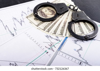 Concept Of Crime, Bribe, Detention. Handcuffs, One Hundred Dollar Banknotes And Result Of Polygraph Lie Detector Test. Top View, Flat, Overhead, Selective Focus