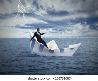 Concept Of Crisis And Economic Collapse With Sinking Boat