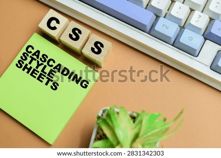 Concept of CSS - Cascading Style Sheets write on sticky notes isolated on table.