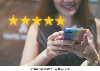 Concept Of Customer Review Or Feedback, People Use Smartphone With 5 Star Icon, Customer Review Good Rating.