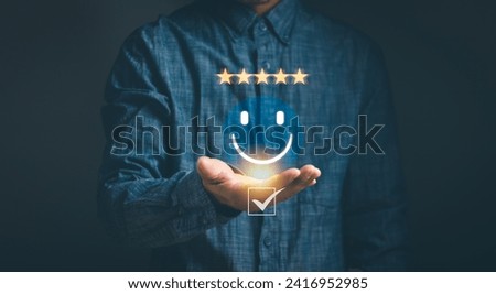 concept of customer satisfaction ,Client experience Best service review, man with smiley face icon on hand To provide excellent five star positive feedback rating for best products and services.