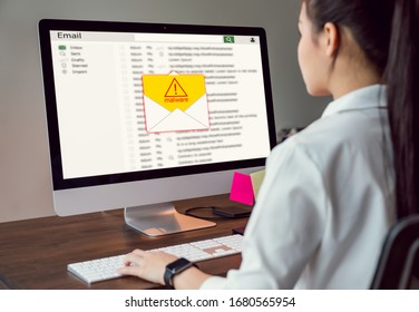 Concept Of Cyber Crime, Businesswoman Using Computer And Show Malware Screen That Comes With Email, Hack Password From Bank Accounts And Personal Data.