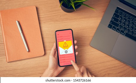 Concept Of Cyber Crime, Hand Holding Smartphone And Show Malware Screen That Comes With Email, Hack Password From Bank Accounts And Personal Data.