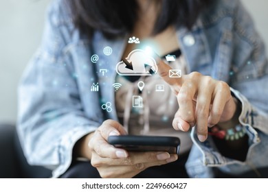 Concept of data cloud computing. Woman using smartphone and Pointing finger to cloud icons. connect devices information technology server innovation virtual. security data storage.