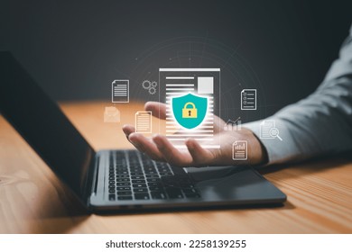 concept is data security access. Shield on a computer desktop or laptop protect sensitive data. Internet security.