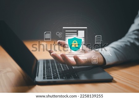 concept is data security access. Shield on a computer desktop or laptop protect sensitive data. Internet security.