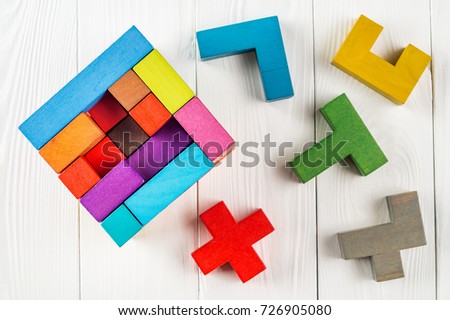 Concept of decision making process, creative, logical thinking. Geometric shapes in different colors, top view. Choose correct answer. Logical tasks. Conundrum, find the missing piece of the proposed.
