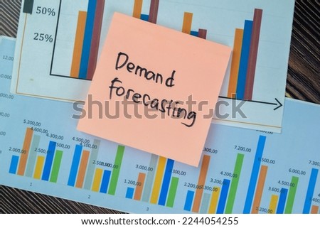 Concept of Demand Forecasting write on sticky notes isolated on Wooden Table.