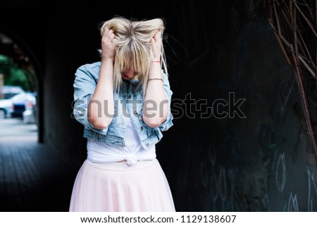 Similar – Young blonde woman with a headache