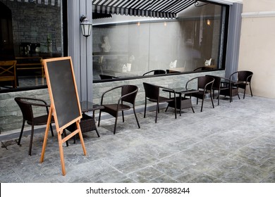 Concept and design front of Coffee Shop with black board and black seating