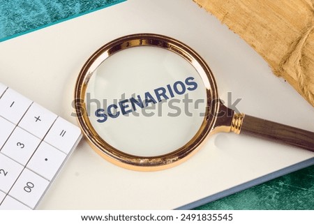The concept of developing scenarios and action plans. SCENARIOS appeared through a magnifying glass in a notebook, close-up. View from above