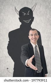 Concept Of Devil Businessman With Hand Drawn Evil Shadow.