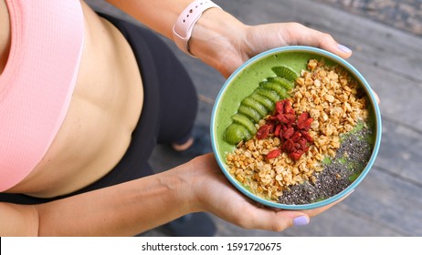 Concept Of Diet, Proper Nutrition And Health. Sport Woman Holding Smoothie Bowl
