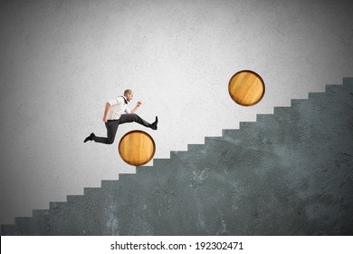 Concept of difficulty with businessman that jumps obstacles