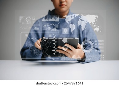 Concept of digital diagram, graph interfaces, virtual icon. Team of business analysts discussing the business strategy in contemporary using on smartphone and tablet with startup project in office.