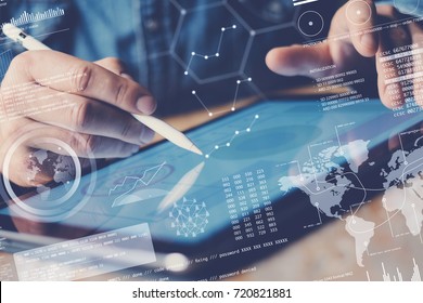 Concept of digital diagram,graph interfaces,virtual display,connections icon.Businessman working contemporary electronic tablet at office.Blurred background. Horizontal