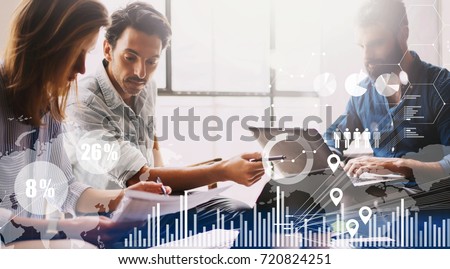 Concept of digital diagram,graph interfaces,virtual screen,connections icon on blurred background.Group of three young coworkers working together at modern coworking studio