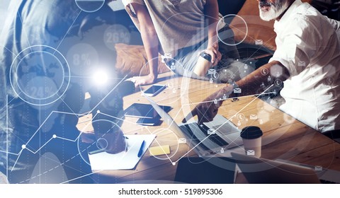 Concept of digital screen ,virtual connection icon,diagram, graph interfaces.Team young coworkers making great work discussion in modern office.Business teamwork photo.Horizontal closeup