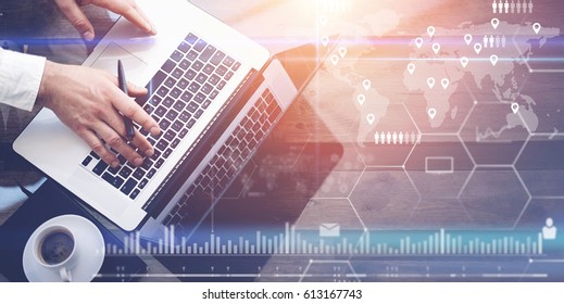 Concept Of Digital Screen,virtual Connection Icon,diagram,graph Interfaces.Businessman Working With Laptop At Office.Modern Notebook,cup Of Black Coffee On Wooden Table.Sunlight Effect Glass Surface