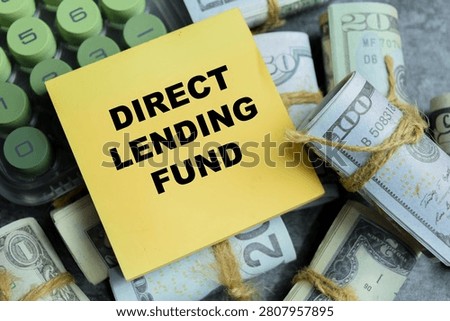 Concept of direct lending fund write on sticky notes isolated on Wooden Table. For private credit investment strategy and corporate debt managements