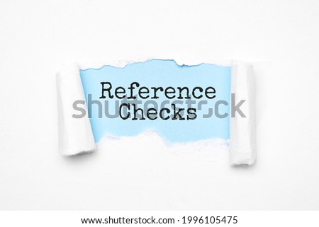 Concept of discovering REFERENCE CHECKS tricks. Uncovered unrolled beige torn paper and search engine optimization abbreviation.