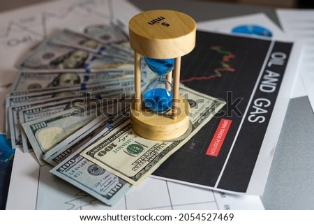 Concept With Dollar Chart And Hourglass