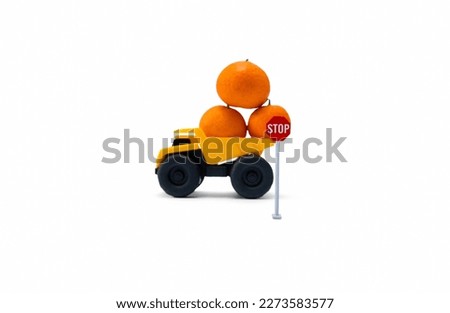 Concept for don't overload when bringing stuff. A photo after some edits, a yellow truck brings some oranges and flipped over.