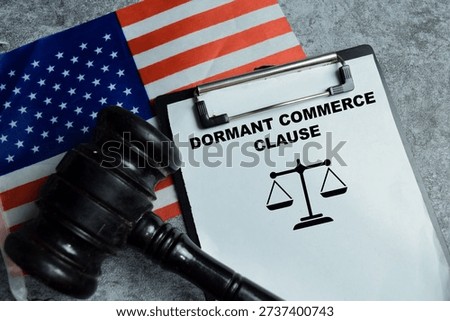Concept of dormant commerce clause write on clipboard isolated on Wooden Table. Interpretation in United States law interstate trade regulation and State restriction on commerce