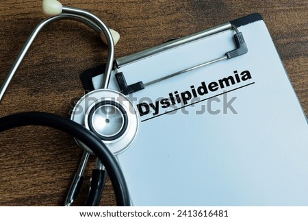 Concept of Dyslipidemia write on paperwork with stethoscope isolated on wooden background.