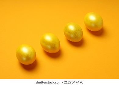 Concept of Easter eggs on orange background