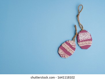Concept for Easter. Handmade eggs on a blue background. Happy easter greeting card. Copy space