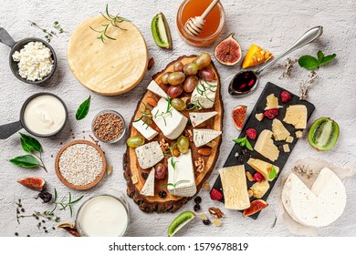 The concept of eco products. Organic farm dairy products, cheeses, cereals and wine. Parmesan, feta, goat cheese, red wine. Background image. Copy space. - Shutterstock ID 1579678819