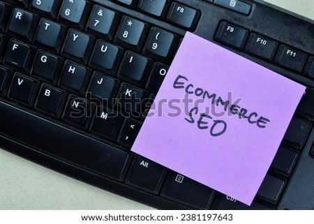 Concept of Ecommerce SEO write on sticky notes isolated on Wooden Table.
