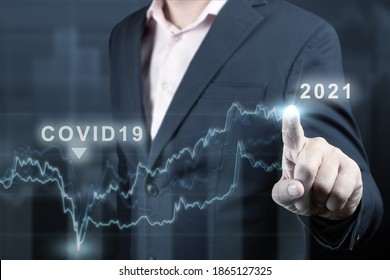 concept of economic recovery after the fall due to the covid 19 coronavirus pandemic. Double exposure of financial graph. Businessman pointing graph corporate future growth plan on dark blue