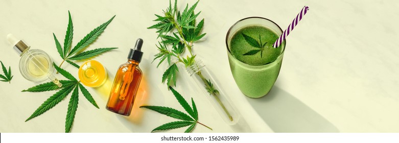 Concept Edibles CBD And Drinks With Cannabis . Glasses With Fresh Beverage, Smoothies, With Hemp. Flat Lay Banner