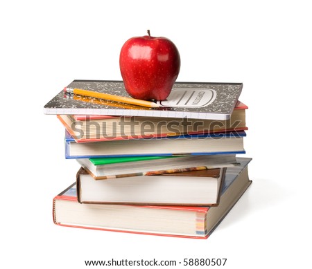 Concept of education. A red apple and pencil sitting on top of a stack of school books.